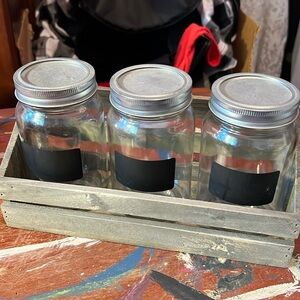 3 glass jars in wooden crate
